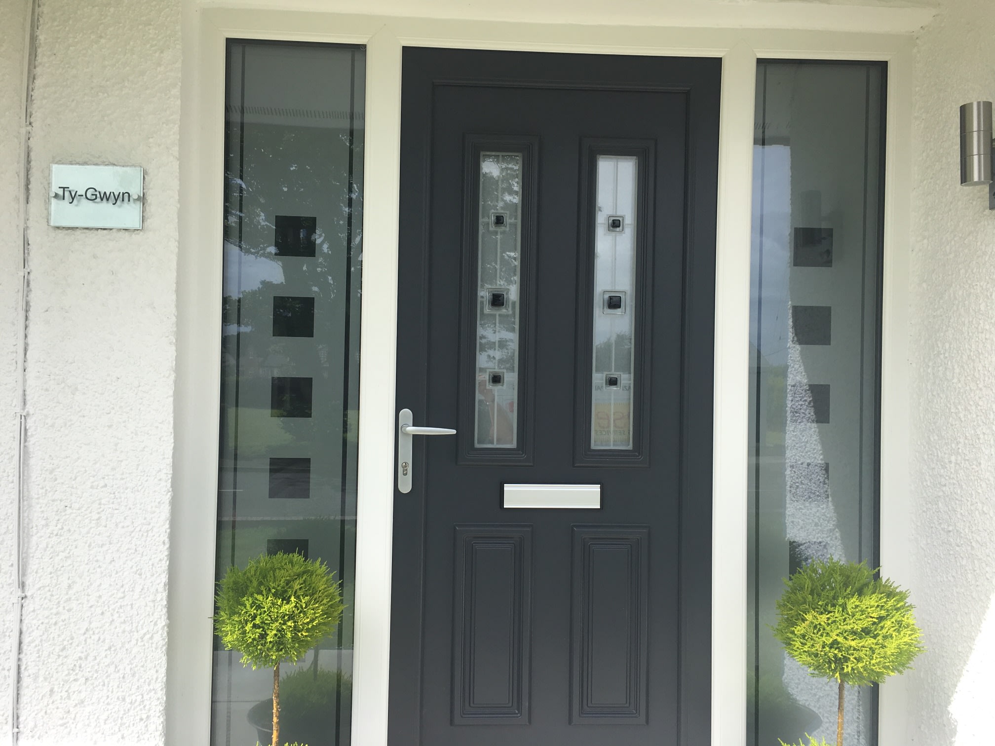 Grey entrance door and matching glazed side panels from Breese’s project gallery